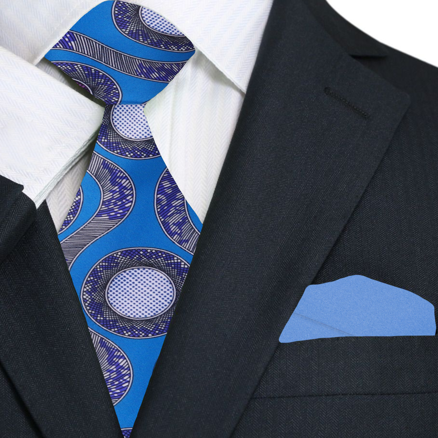 Blue and purple patterned tie with matching pocket square on a black suit jacket.