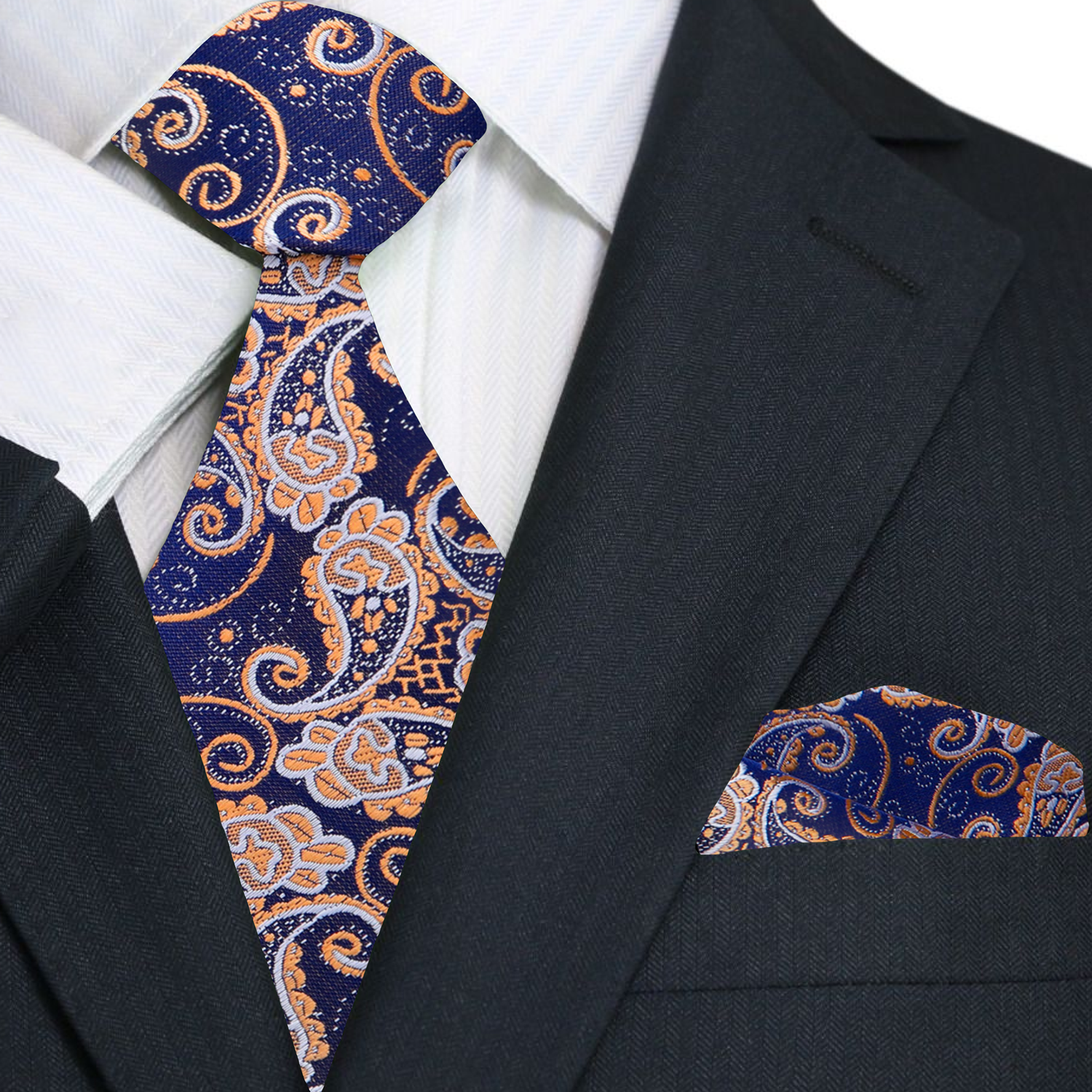 Navy suit with brown paisley tie and pocket square