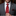 Man in a gray suit with a red striped tie in an elegant interior setting