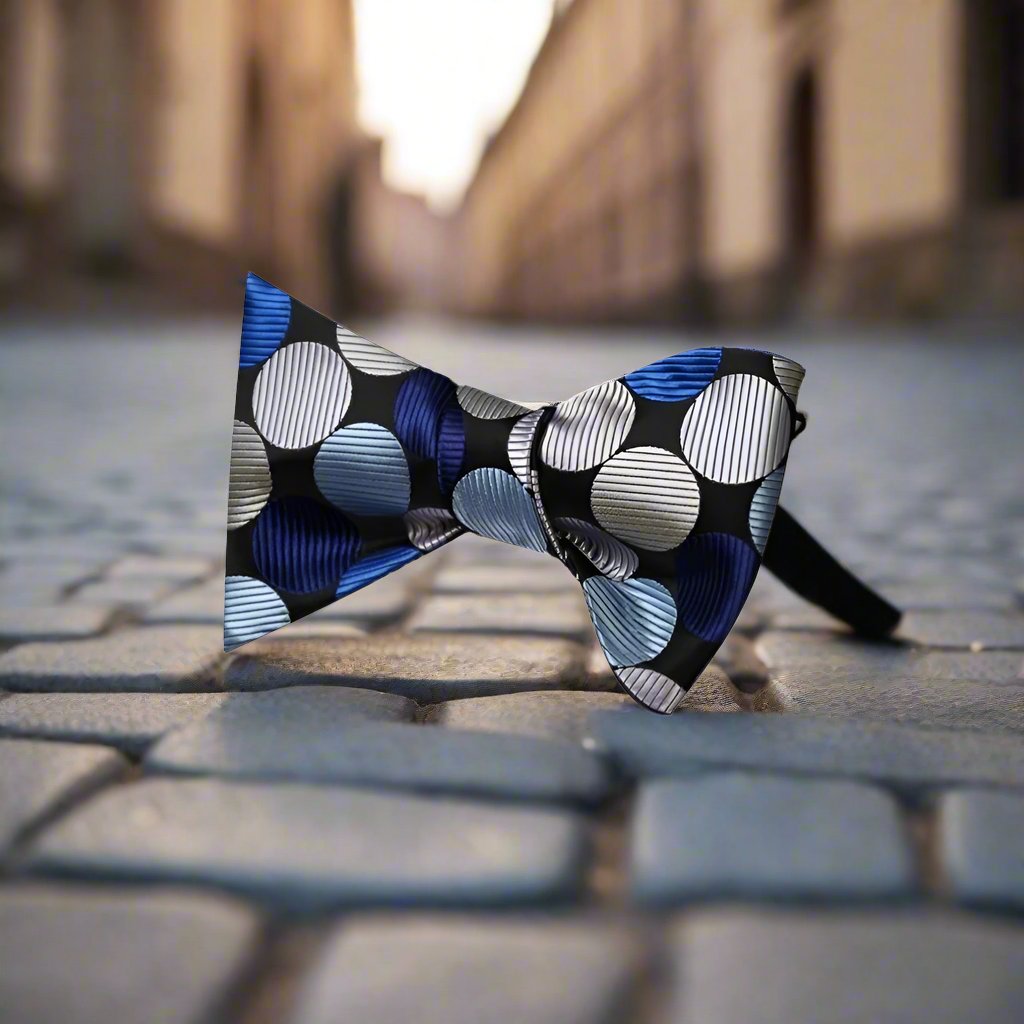 A Black, Blue, Silver Large Polka Pattern Silk Self Tie Bow Tie