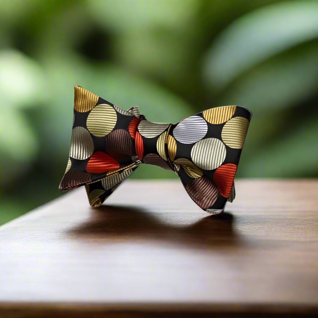 A Orange, Gold, Brown Large Polka Pattern Silk Self Tie Bow Tie