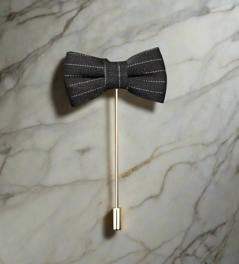 A Black, White Pinstripe Colored Bow Tie Shaped Lapel Pin||Dark Grey with White Pinstripe