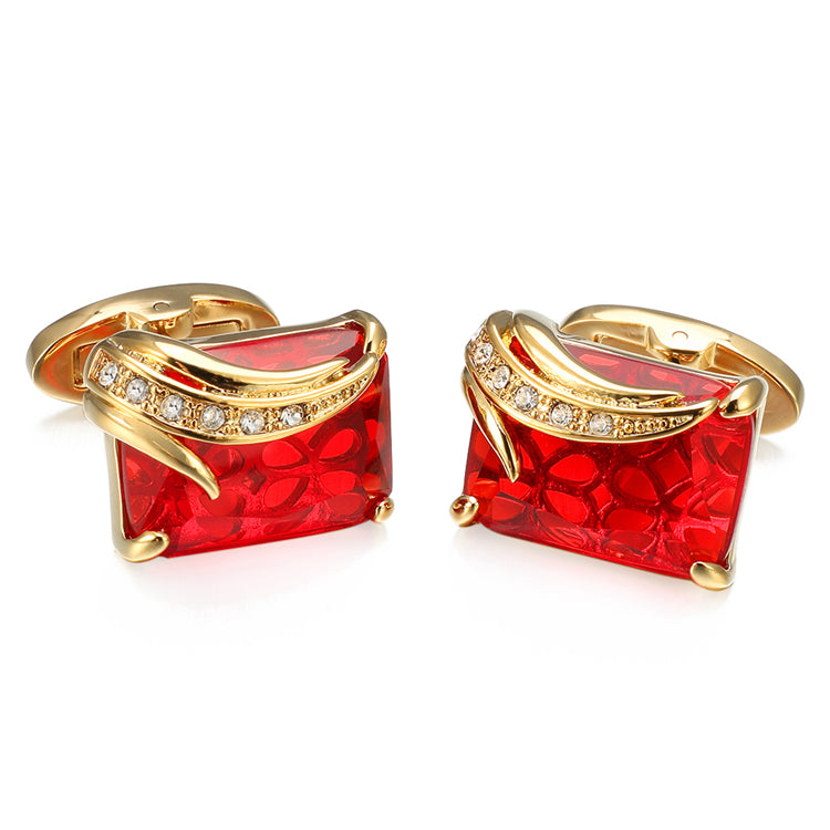 A Gold Colored with Clear and Red Gemstones Cuff-links.