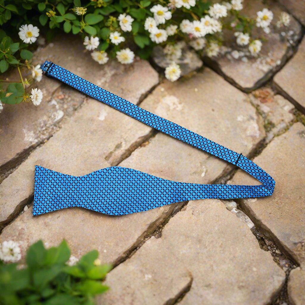 Alt view: A Light Blue, White Small Geometric Diamond With Small Dots Pattern Silk Self Tie Bow Tie