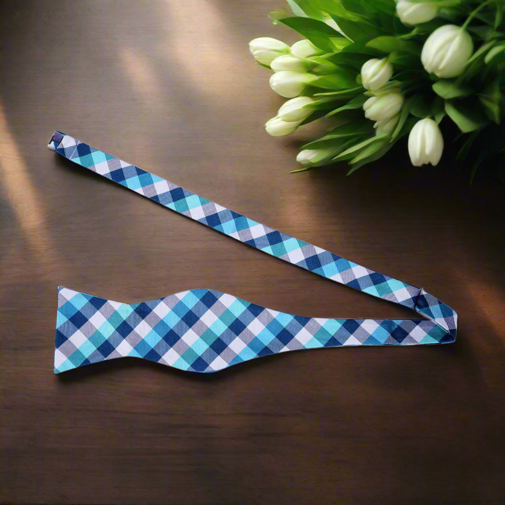 A Light Blue, White Geometric Check Pattern Silk Self Tie Bow Tie Untied