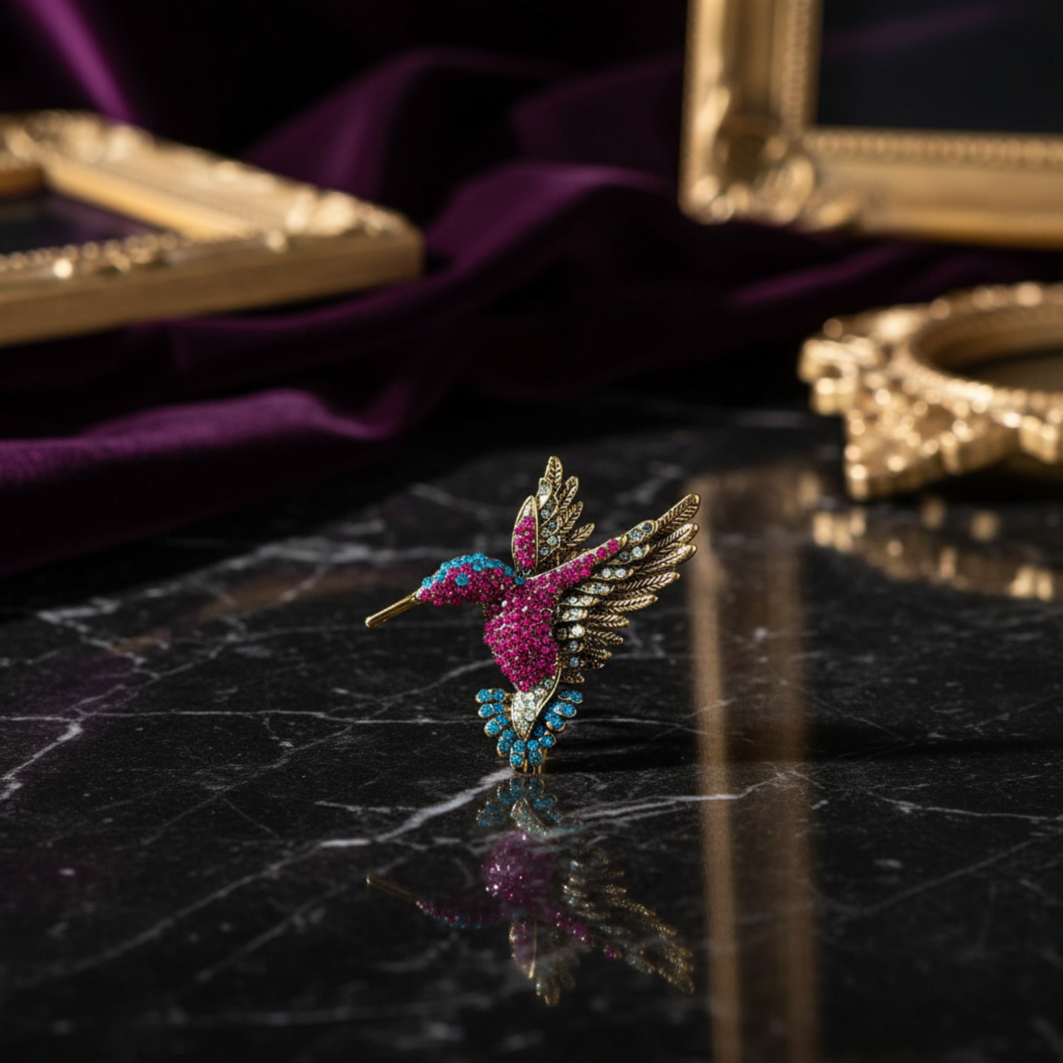 Decorative hummingbird brooch with gemstones on a white background