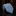 Blue paisley patterned tie on a reflective surface with a blurred background