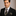 Black and Gold Tie and Square on Man Wearing Suit