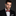 Black, Brown Abstract Self Tie Bow Tie and White Square on Man Wearing Black Suit