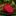 Red tie on a black marble surface with a blurred garden background