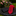Red tie and black pocket square on a stone surface with flowers in the background