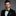 Man wearing black and green circles bow tie and handkerchief