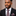 Man Wearing Brown Pink and White Plaid Tie and Square 
