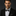 Man wearing a black tuxedo with a Black, Silver Big Polka Bow Tie and Pocket Square