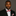 Man wearing a black suit with a red and white stripe bow tie and pocket square on a brown background