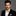 Man wearing a black suit and Shades of Yellow and Brown Paisley Bow Tie and Square
