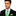 Green with Blue Dots Tie and Pocket Square on man wearing black suit