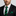 Man wearing black and green stripe tie and square