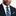 Man wearing A Blue, Light Blue, Green Stripe Pattern Necktie, Matching Pocket Square