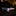 Eagle-shaped pin with American flag design on a dark surface