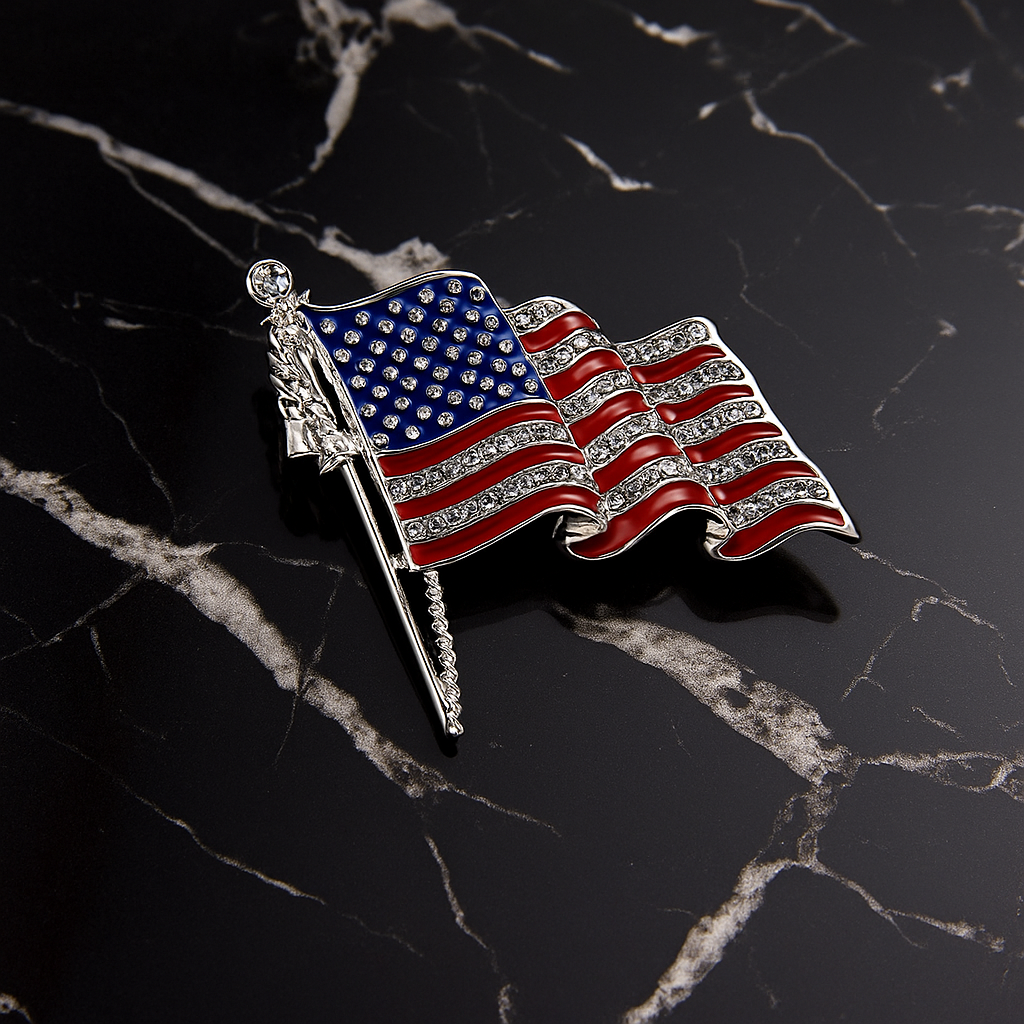 American flag brooch with rhinestones on a black marble background