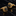 Gold cufflinks with black gemstones on a reflective black surface