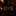 Brown bow tie with floral patterns on a dark surface, with a blurred background