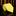 Yellow tie rolled up on a reflective black surface with a brown curtain background