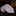 Roll of blue paisley-patterned fabric with a glass of whiskey in the background