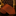 Orange patterned tie on a dark background