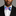 Man wearing a colorful bow tie against a gray background