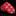 Red tie with white zigzag pattern on a textured black background