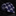 Navy blue tie with white chevron pattern on a dark marble surface