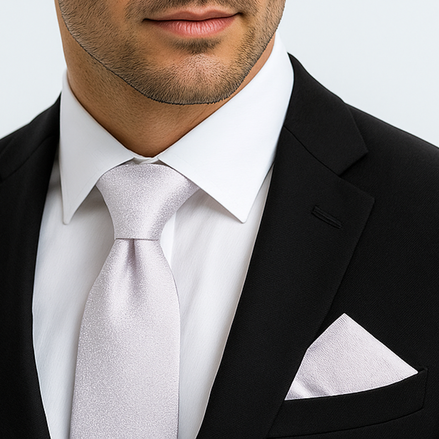 Man wearing luxury shimmer silver tie and square 