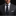 man wearing black blue paisley floral tie and accenting square