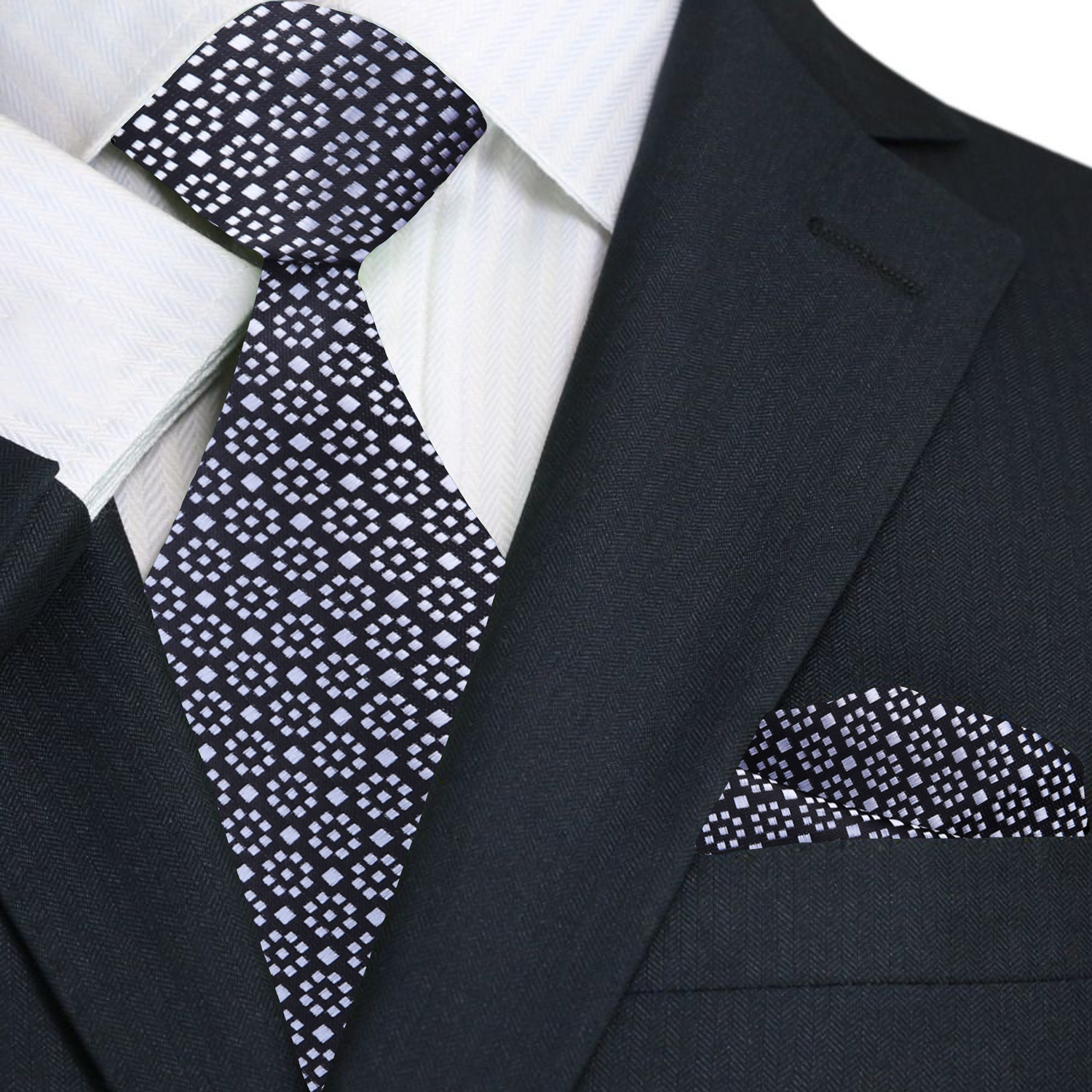 Black suit with a patterned tie and pocket square on a white background