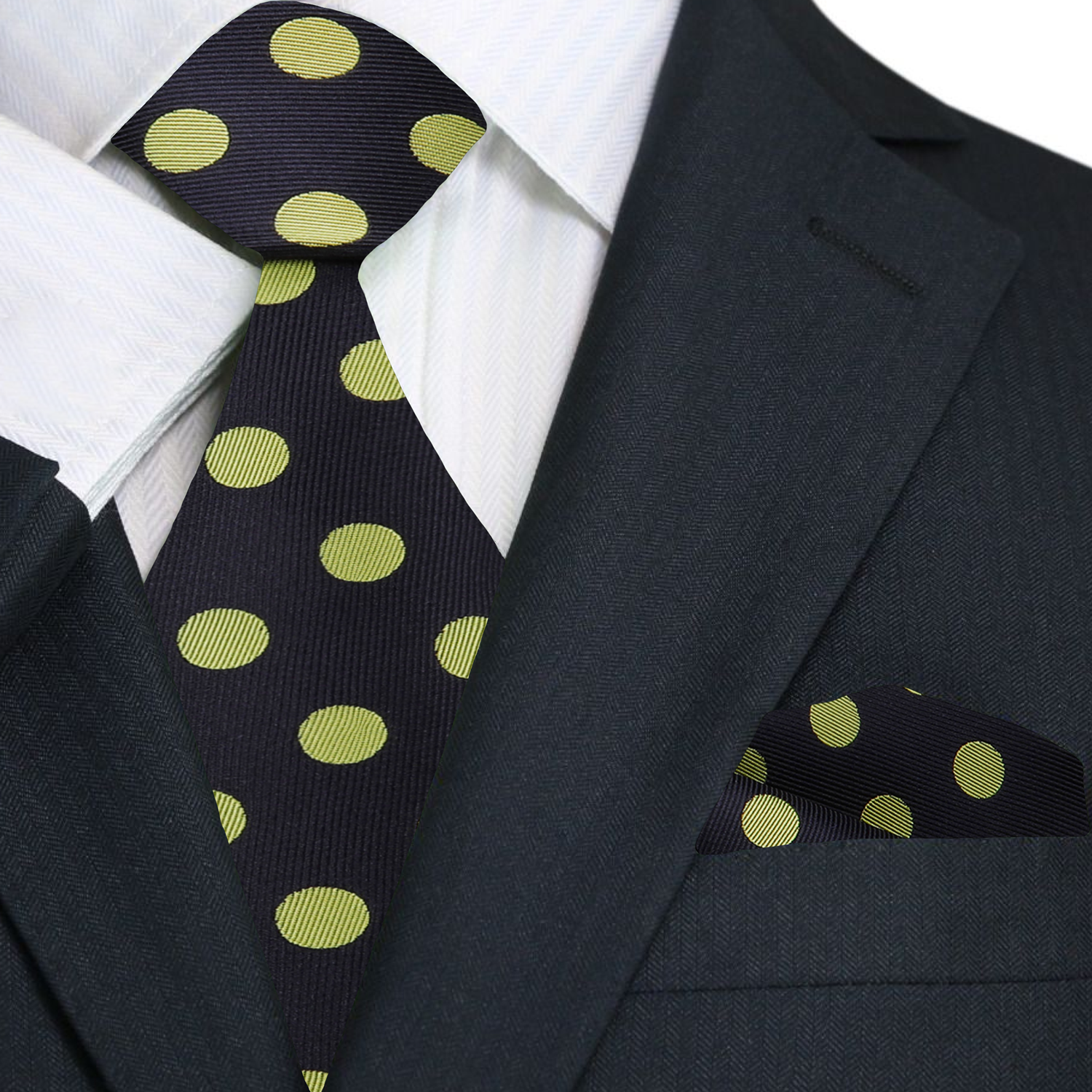 Black suit with a polka dot tie and pocket square