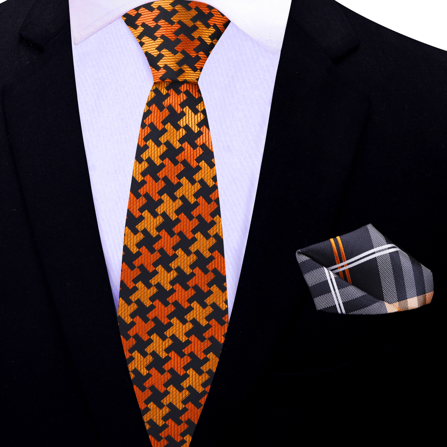 Orange and black patterned tie with matching pocket square on a suit.