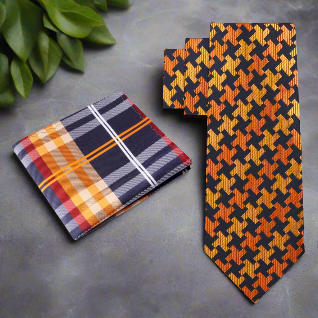 Set of plaid pocket square and houndstooth tie on a white background