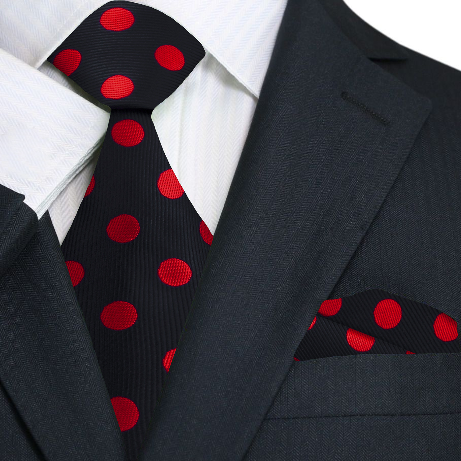 Black suit with a red polka dot tie and matching pocket square.