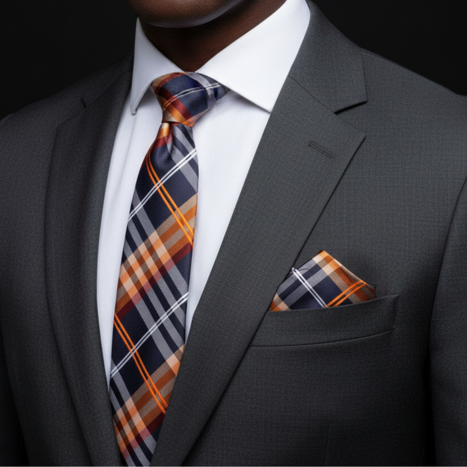 Black and Orange with White plaid Tie and Square on Man