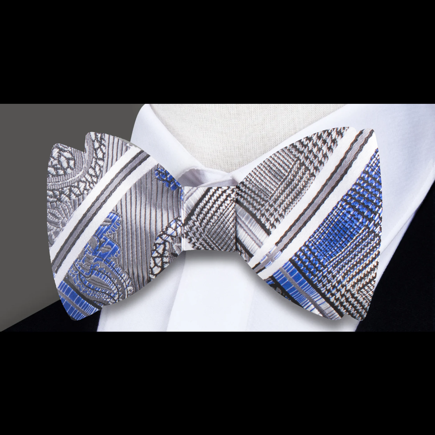 A Silver, Black, Blue Geometric and Paisley Pattern Silk Self Tie Bow Tie