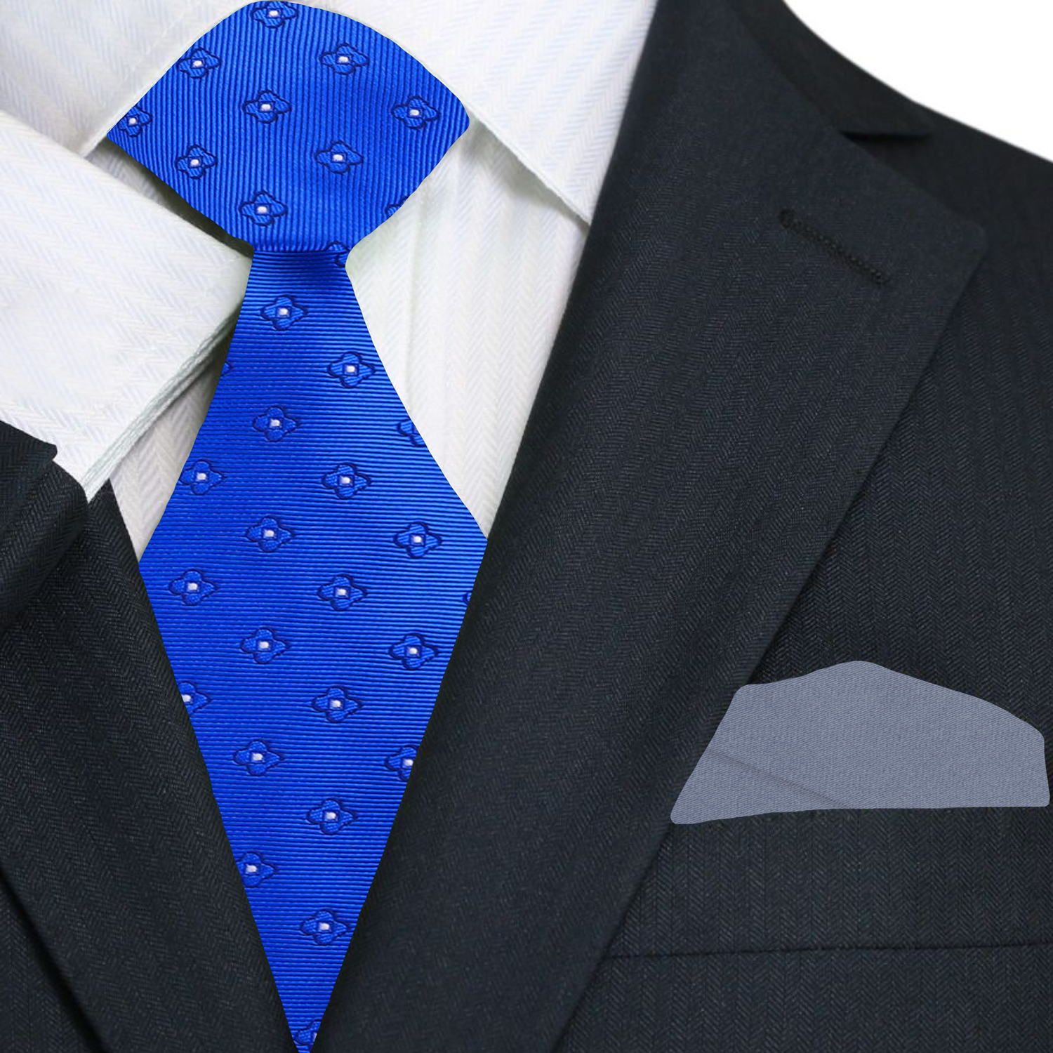Blue small flowers patterned tie worn with a black suit and white shirt.