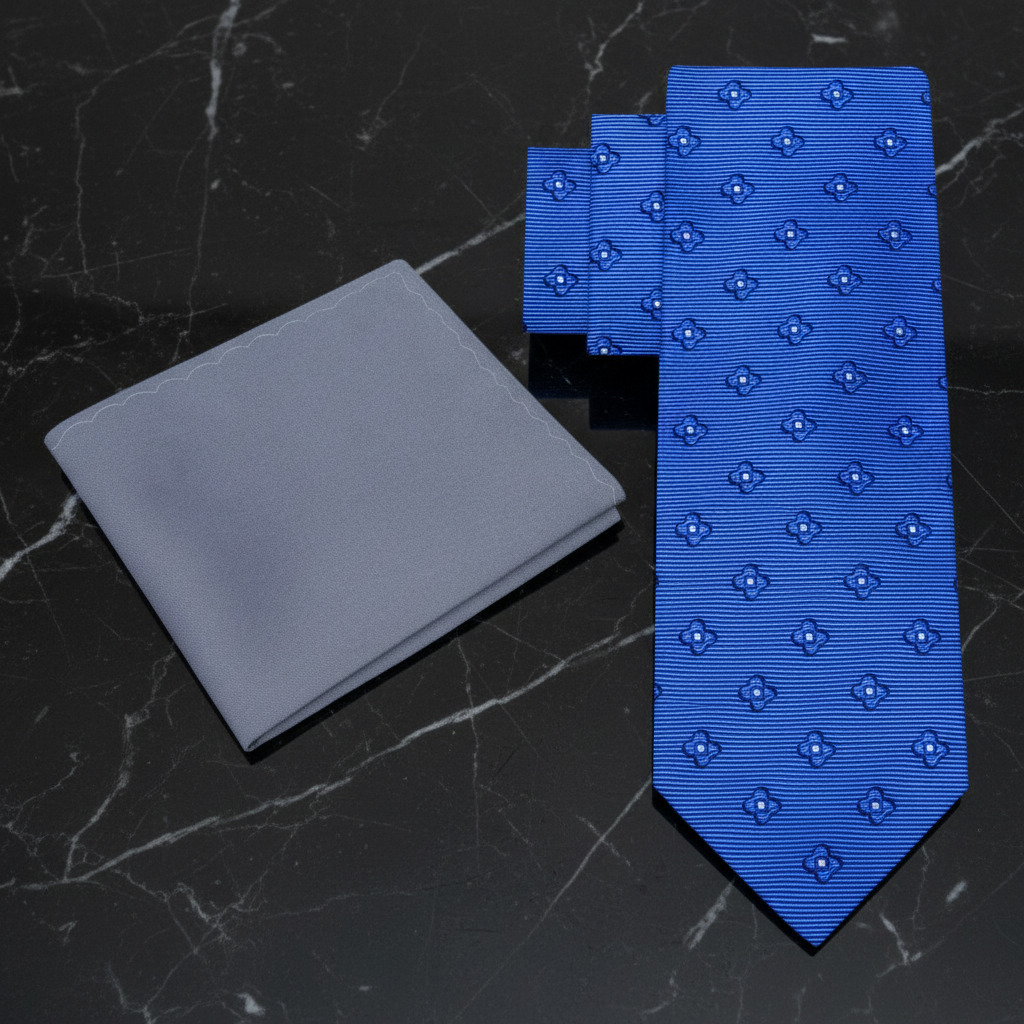 Blue tie with pattern and gray pocket square 