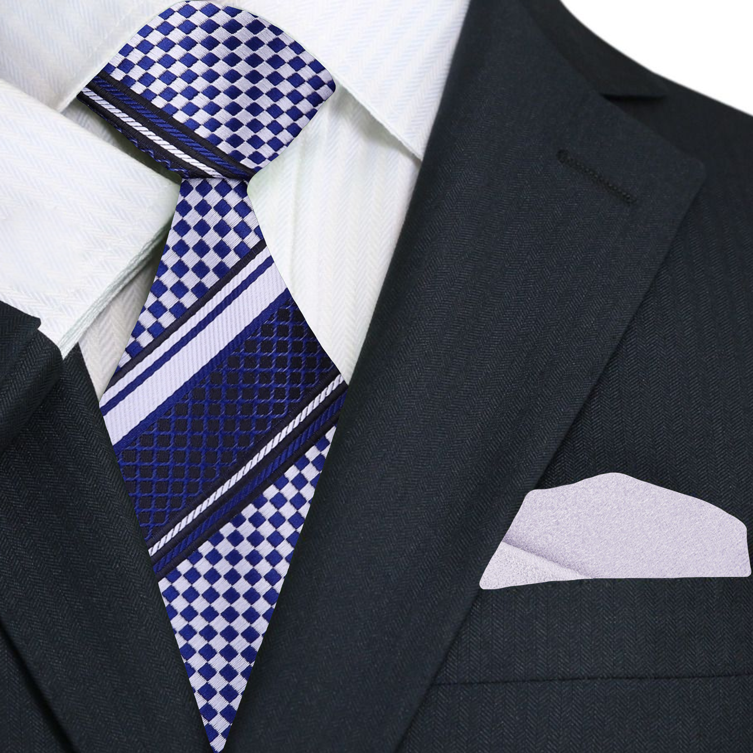 Navy suit with a white dress shirt, blue patterned tie, and silver pocket square.