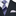 Navy suit with a white dress shirt, blue patterned tie, and silver pocket square.