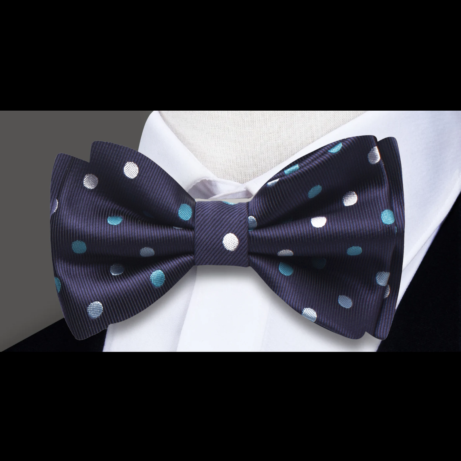 A Blue, White Polka Dot Pattern Self Tie Bow Tie 