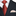 Black suit with a red tie and patterned  light gold and red geometric pocket square