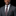 Man wearing a gray suit with a patterned brown tie and pocket square on a black background