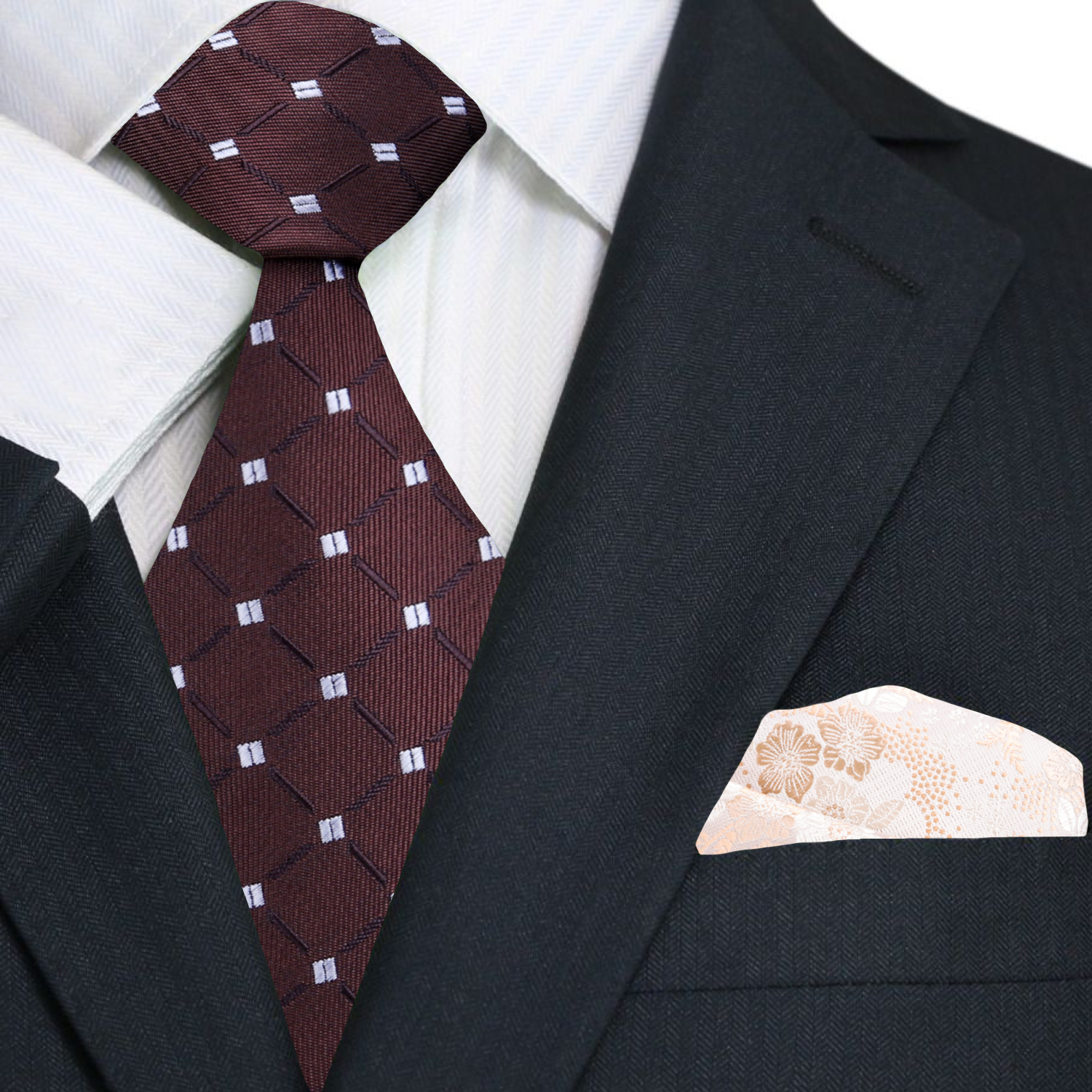 Black suit with a brown patterned tie and beige pocket square